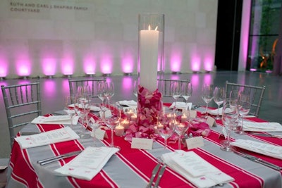 To add warmth to the large space, Hopple Popple added candles to a quarter of the more than 40 tabletop centerpieces.