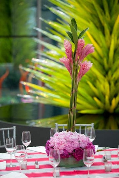 Tall floral arrangements anchored by smaller petals added height to tabletops.