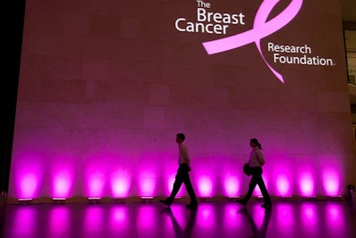 Pink lighting and the Breast Cancer Research Foundation's logo illuminated the courtyard's walls.