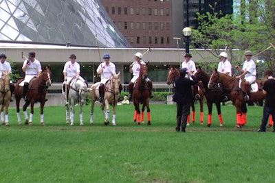 The players and horses assembled at Pecaut Square.