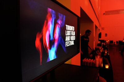 Televisions bordered the dance floor, showing trailers for upcoming festival films.