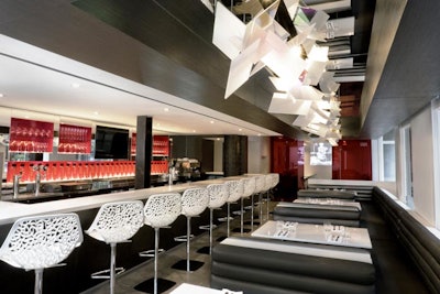 Black leather booths are reminiscent of a New York diner.