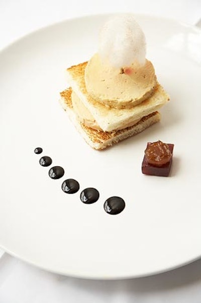 Torchon of foie gras tower with blood orange, ginger, and aged balsamic reduction, gold-dusted cotton candy, and house-baked brioche, from Global Cuisine by Gary Arabia in Los Angeles