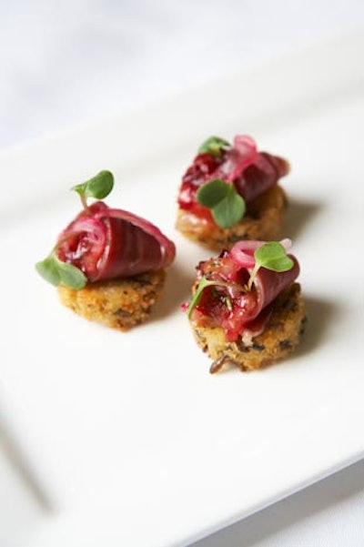 Mini wild rice pancakes with house-made cherrywood-smoked duck and cherry-rosemary chutney, from Lindsey Shaw Catering in Toronto