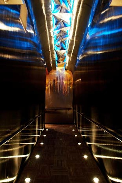 A dark tunnel links the exterior to the main space.