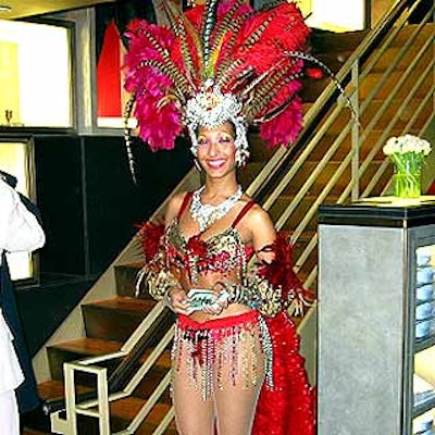 A Vegas-style showgirl from Screaming Queens greeted guests at the New Yorkers for Children benefit organized by Harrison & Shriftman at the new Alfred Dunhill store on Madison Avenue.