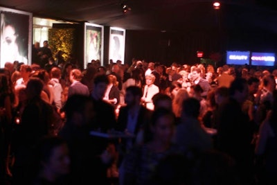 A crowd assembled under a black tent adjacent to the Annenberg Space for Photography to celebrate the opening of the 'Beauty Culture' exhibit.