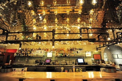 Saber-toothed skulls flank the back of the bar, and the light fixture that hangs over it was crafted to incorporate Ohio piping.