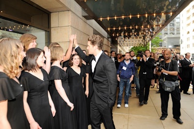 Morrison chatted with a local girl's choir, who sang songs such as 'Lollipop' outside of the theater.