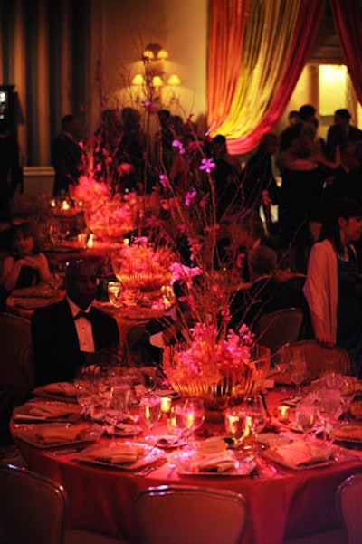 Coral and hot pink orchids and roses decorated the tabletops.