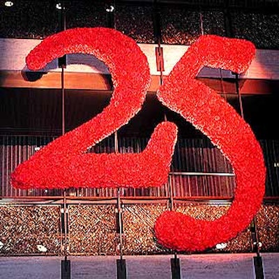 The 25th anniversary sign suspended above the promenade dining area was covered with red roses by Matthew David Events.