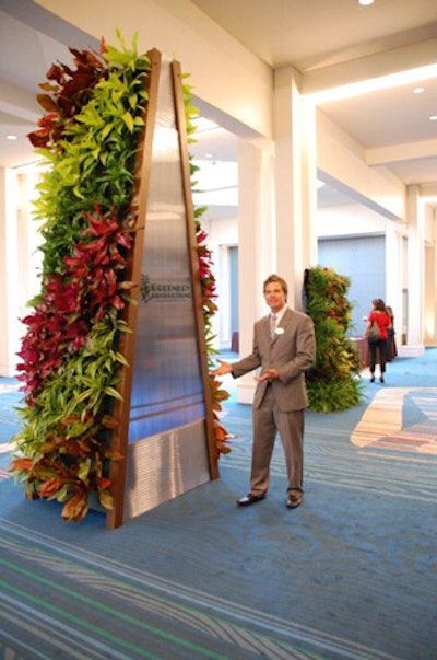 The vertical towers come in eight- and 12-foot heights, filled with plants down two sides and a logo or texture in the middle.