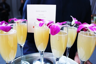 Five cocktails served at the event were themed after the finalists for the women's luxe category of Fragrance of the Year. The drinks included mixes of tequila, peach puree, and lemon for Gucci Guilty (pictured); gin, dry vermouth, cardamom, and black pepper for Voyage d'Hermès; and vanilla vodka, lemon, and orange blossom water for Pure DKNY.