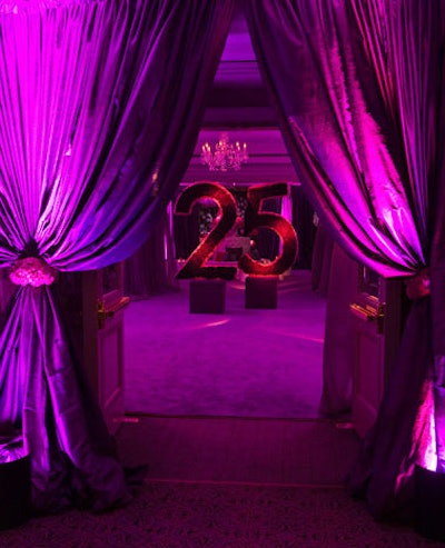 Magenta dupioni drapes with carnation tiebacks framed the entrance to the party.