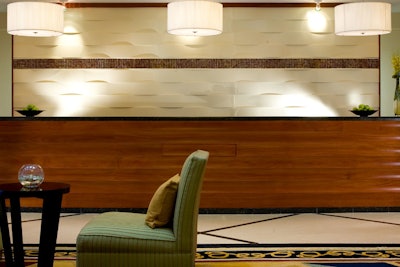 The front desk's design reflects the new color scheme used throughout the hotel.