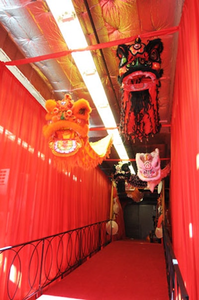 Chinese lion masks, which symbolize good luck, hung above a red-carpet entrance outside the hotel.