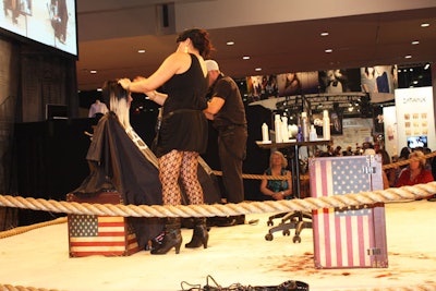 At the Aveda exhibit, hair models sat on vintage steamer trunks on the stage.