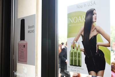 The front doors of the convention center displayed posters from some of the exhibitors to catch attendees' attention as they went in and out.