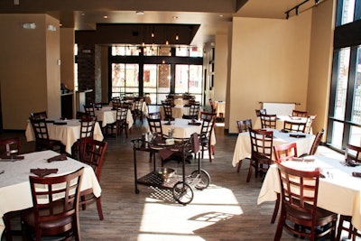 The restaurant is open and bright, thanks to natural light from several floor-to-ceiling windows.