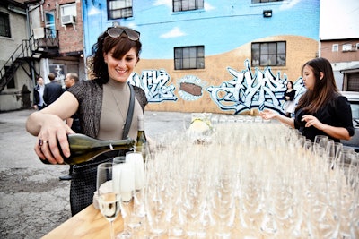 Guests could sample sparkling wine in the parking lot, where graffiti adorned the walls.