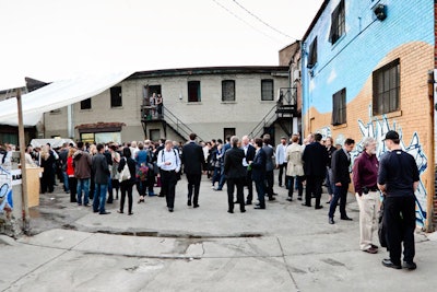 Guests gathered in the parking lot for hors d'oeuvres and sparkling wine.