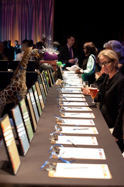 Guests bid on items in a silent auction during cocktail hour.