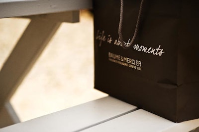 To reinforce its new tagline 'Life is about moments,' Baume & Mercier placed it on various articles, including the gift bags.