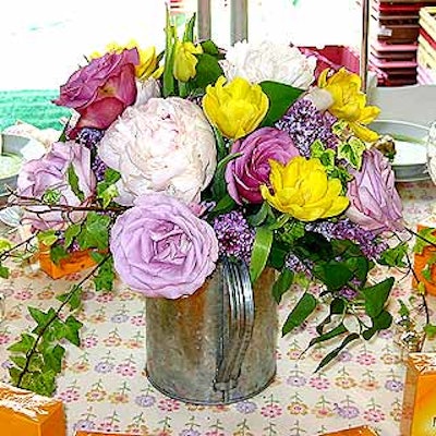 For the Central Park Conservancy's Frederick Law Olmsted awards at the Conservatory Garden, Andrew Pascoe Flowers provided beautiful spring-colored centerpieces with roses, peonies, lilac, tulips, viburnum and ivy set in watering cans.