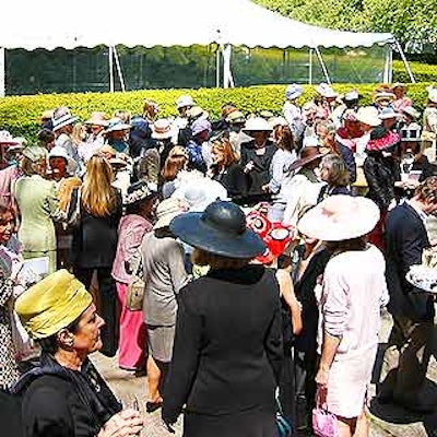 Behatted guests mingled just inside the Conservancy Garden's Vanderbilt Gate.