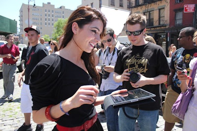 Female staffers dressed in black and sporting temporary tattoos of the Bacardi logo circulated through the crowd, encouraging consumers to sign up for Facebook and 'like' the brand's fan page.