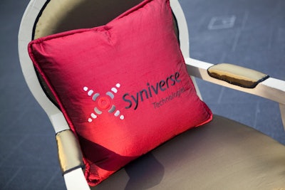 Syniverse's logo adorned the pillows in its sponsored lounge.