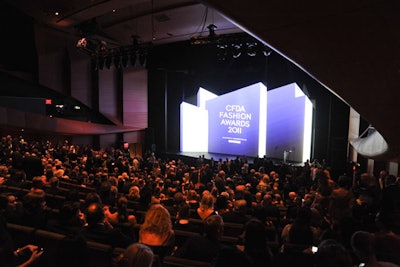 In contrast to last year's curved, Richard Serra-style structure, set designer Scott Pask chose a more linear look for the stage. The design, which was 41 feet wide, 24 feet deep, and 22 feet tall, was inspired by the sharp angular work of Dutch architect and furniture designer Gerrit Rietveld and artist Kasimir Malevich.