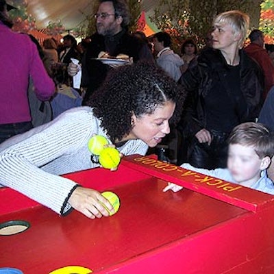 Former ER star Gloria Reuben played a carnival game with one of the event's young guests.