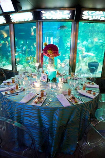Blue linens with aquatic patterns covered some of the dinner tables.