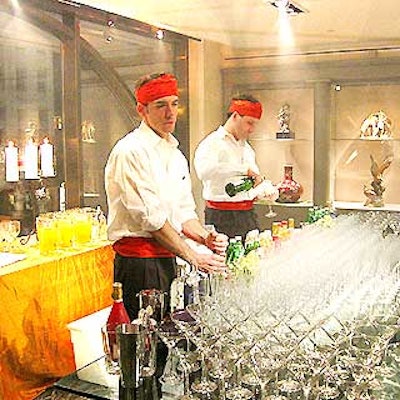 Male caterwaiters from Mood Food were dressed in bright orange waist sashes and headbands.
