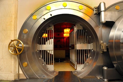 The historic bank building maintains some of its original features, including a vault door.