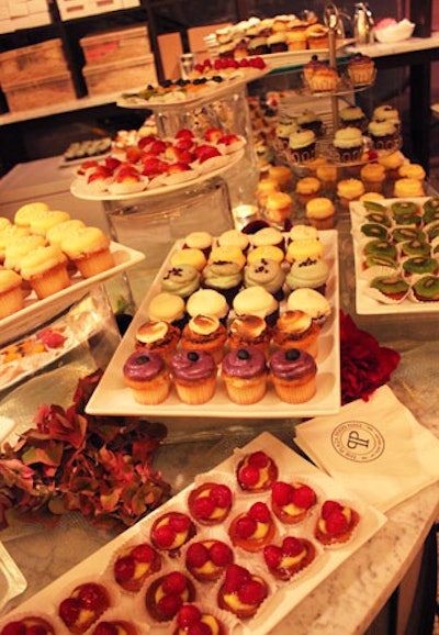 In addition to a spread of artisanal cheese and cured meats, fresh seafood, sushi, pastas, flatbreads, and sliders, the food hall held an impressive array of cupcakes and miniature fruit tarts.