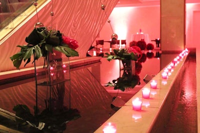Downstairs, on the floor that houses the hotel's shops and food hall, the event organizers filled the koi pond with arrangements and balls of pink peonies and orchids, and lined the pool with dozens of pink votives.