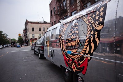 Tattoos were what Norman Collins ('Sailor Jerry') was known for, so the vintage Airstream trailers are decorated with tattoo-style designs. A fleet of these vehicles will travel across the country as part of the promotion, making stops at music festivals, biker rallies, and barbecue championships.