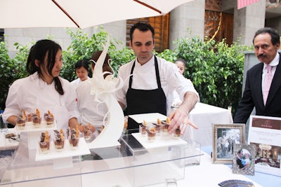 At the stations, big-name chefs were also accompanied by long-serving partners and talent. For example, Daniel pastry chef Dominique Ansel (pictured, center) joined his boss, Daniel Boulud, at the table where they served Caraibe chocolate mousse with caramelized sablé and dulce de leche cream.