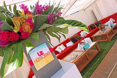 Logoed placards announced the host on colorful flower arrangements from R. Jack Balthazar.