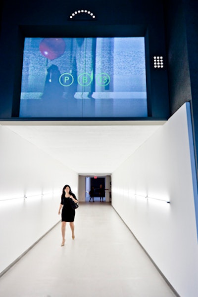 Guests entered the party through a long white hallway with the PB13 logo projected on a screen overhead.