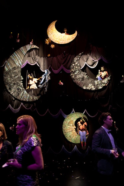 Karen Azoulay created a live sculptural piece for the V.I.P. room. In the piece, called 'The Paper Moons of Jupiter,' actors sat inside the large installation and provided a moving backdrop for the party.