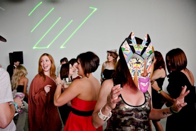 At midnight, guests could try on masks on the dance floor to see Assume Vivid Astro Focus's laser show in 3-D.