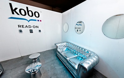 The Kobo reading room was lit with blue lights and furnished with silver pieces. Three Kobo readers were available for guests to try.