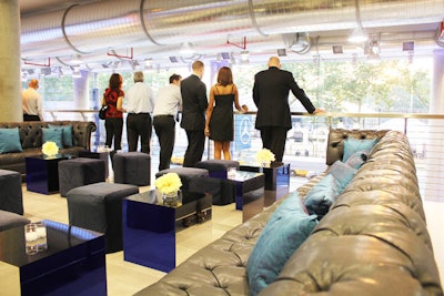 To complement the venue and allow the architecture and cars on display to be the focus of the evening, Van Wyck & Van Wyck chose a largely white palette for the furnishings added to the space. In a few areas, blue Chesterfield sofas matched the hue of the site's signage and LED picture wall.