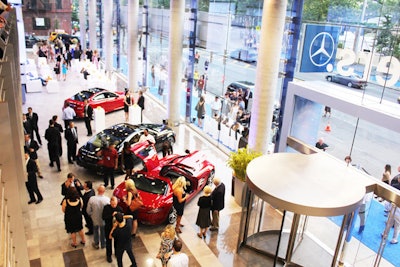 After walking a blue carpet, guests filled the ground-floor space, investigating the cars on display and new reception and sales desks and customer lounges. The venue is designed to reflect Mercedes-Benz's 'autohaus' standards for style and technology use, and the event was partially a showcase of this for the owners of authorized dealerships.