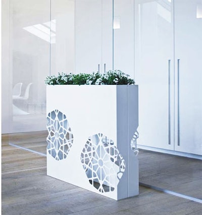 The collection includes this planter, with decorative cutouts.