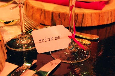 At the V.I.P. dinner, glasses were marked with 'drink me' labels, just like in the story.