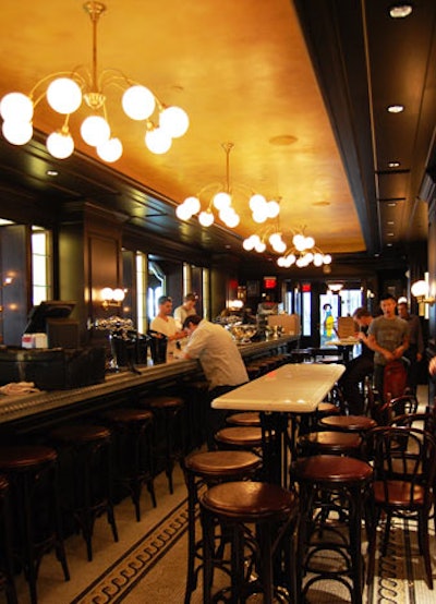 The marble bar has matching marble tables in the centre of the room.